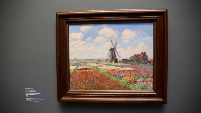 Claude Monet's Tulip Fields in Holland hanging on a wall.