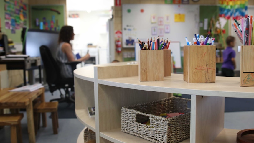 Primary school classroom with wooden shelf