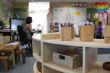 Primary school classroom with wooden shelf
