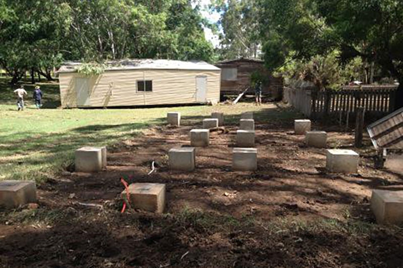 Kroombit's conference hall was ripped from its concrete stumps and washed into another hut