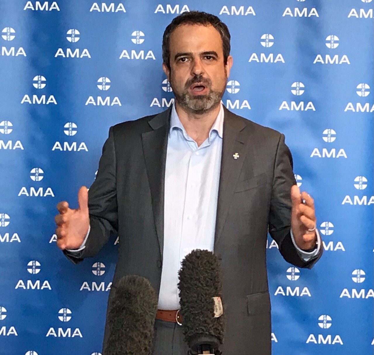 a man with arms open and talking