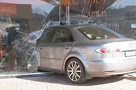 Car hits pizza shop