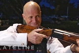 Senator David Leyonhjelm aiming a shotgun on Lateline, October 20, 2016.