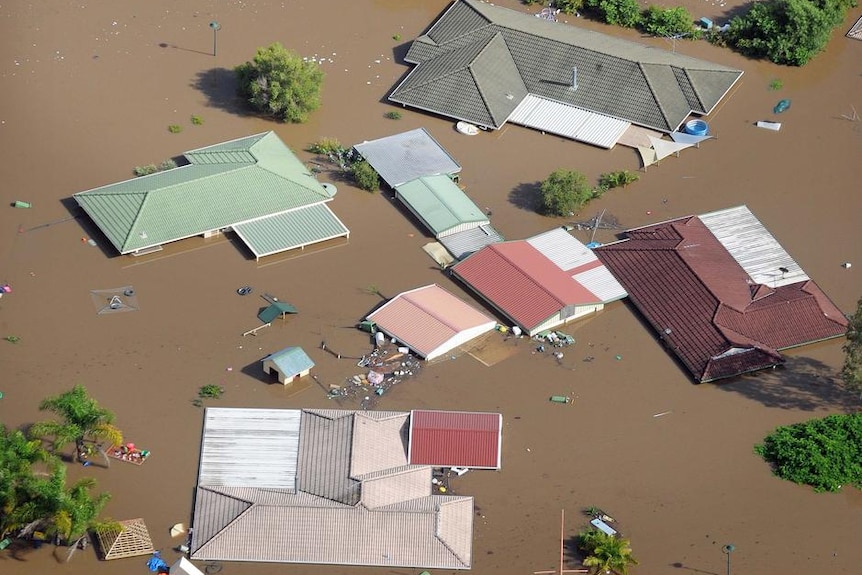 Aerial view of homes covered by floodwaters in Ipswich, west of Brisbane, on January 12, 2011.