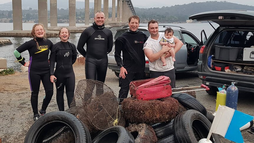 Divers pose with rubbish haul from the River Derwent.