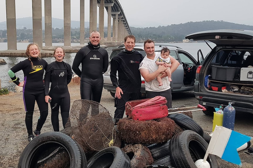 Divers pose with rubbish haul from the River Derwent.