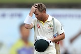 A man leaves the pitch after being dismissed in a test match