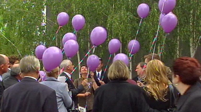 After the memorial family and friends released purple balloons.