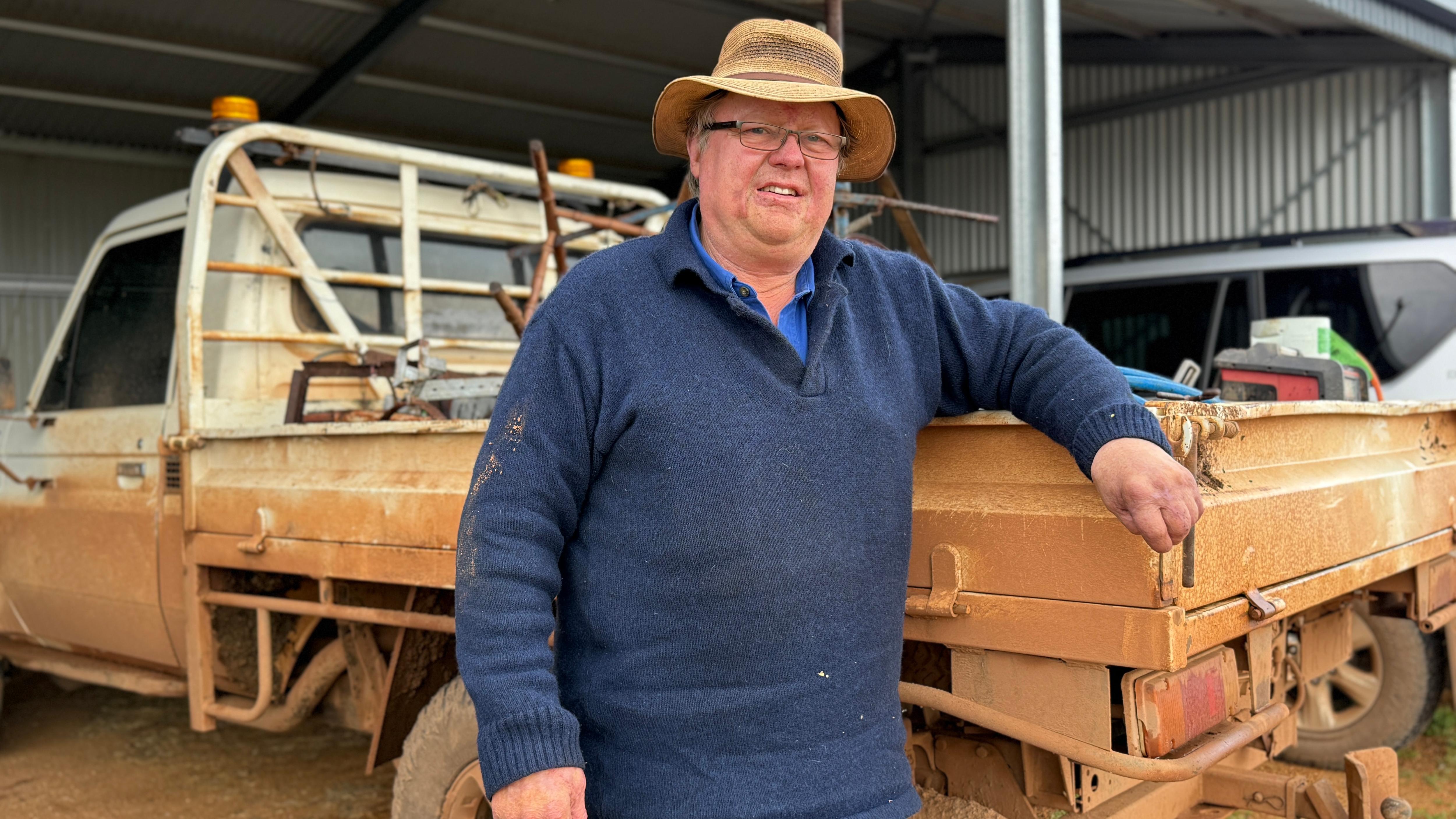 man standing in front of a ute