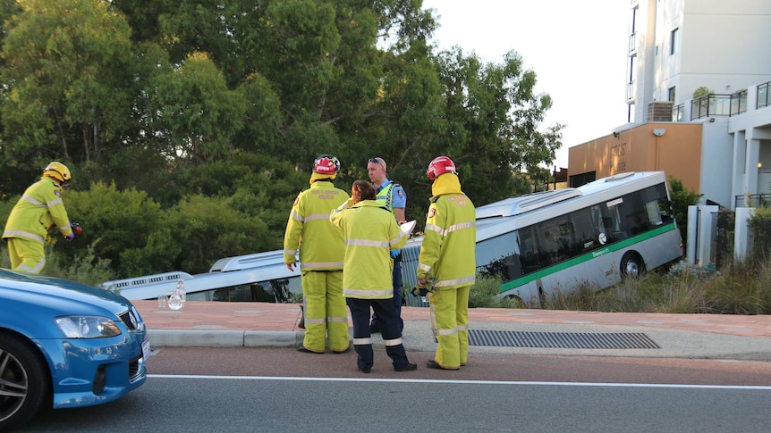 Emergency services workers in front of a bus crash