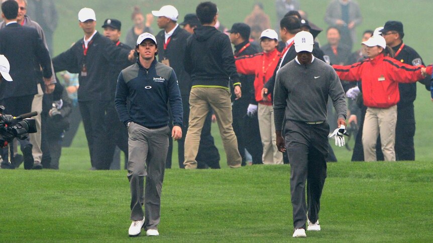 McIlroy and Woods walk the fairways