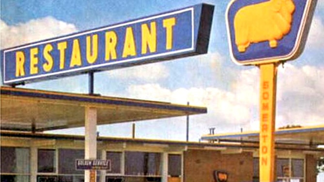 Photo of a blue and yellow golden fleece service station and restaurant. 