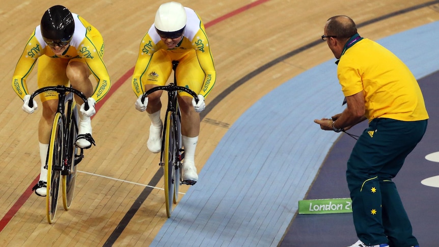A coach shouts instructions to Kaarle McCulloch and Anna Meares in the track cycling.