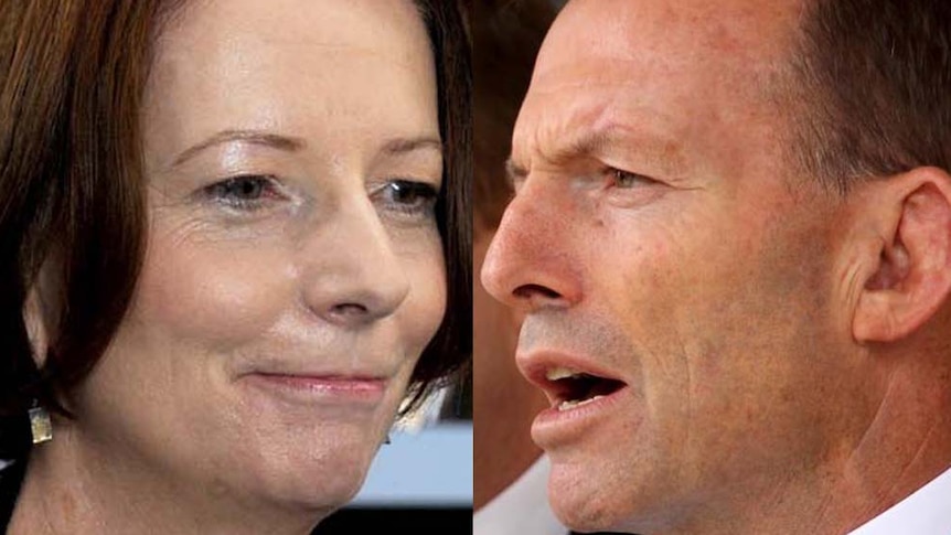 Julia Gillard (L) came under repeated attacks from Tony Abbott (R) in Question Time over the carbon tax.