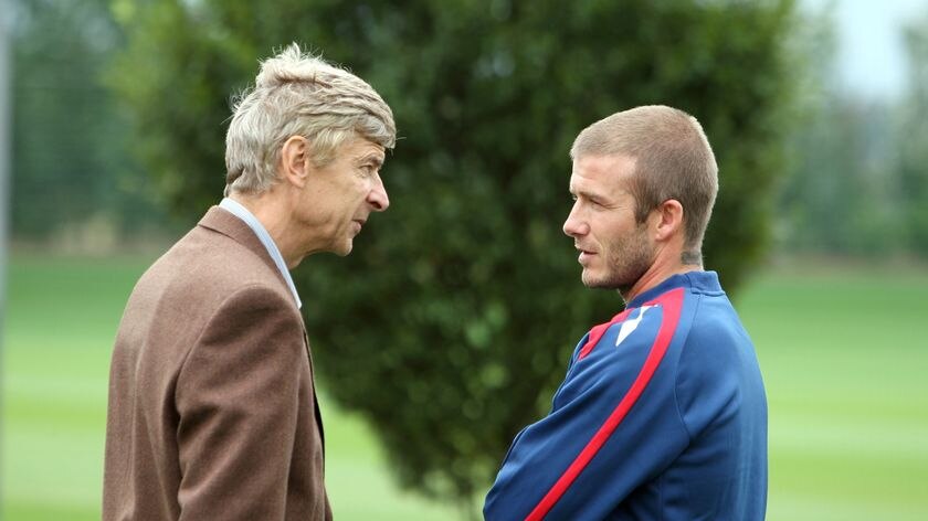 Arsenal manager Arsene Wenger talks with David Beckham during an England training session
