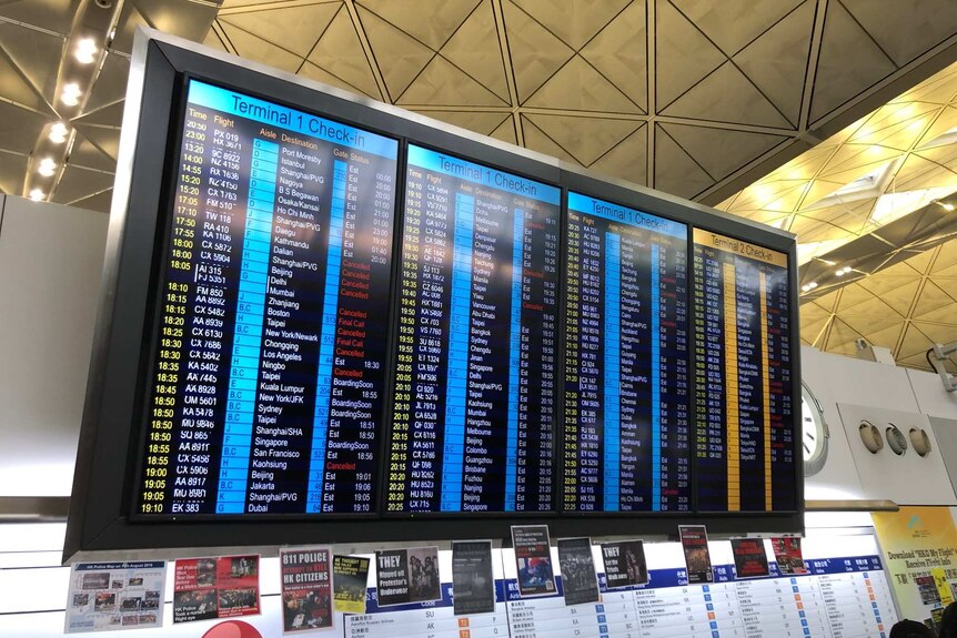 Flight status board at Hong Kong airport