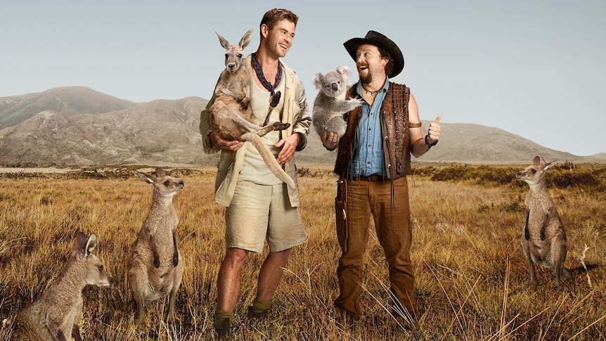 An edited Australian outback scene depicts Chris Hemsworth holding a kangaroo while Danny McBride holds a koala.