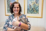 Carer Lindy Butcher with wombat joey