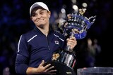 Ash Barty celebrates with the Daphne Akhurst Memorial Cup after winning the Australian Open final.