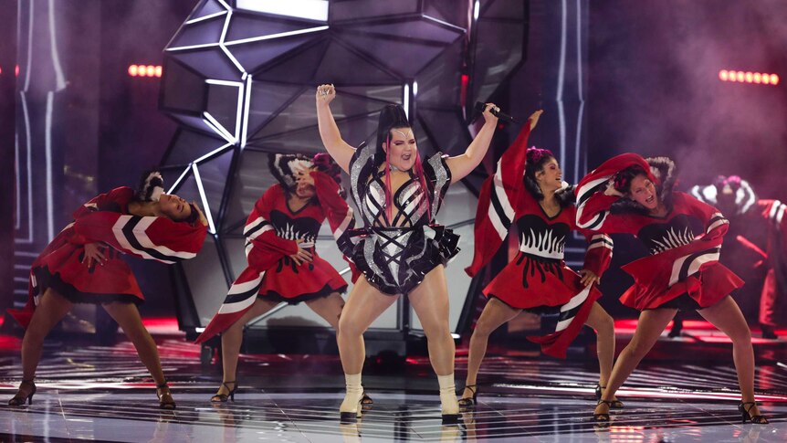Performer dances on stage with four backing dancers behind her at Eurovision 2019 semi-final one.
