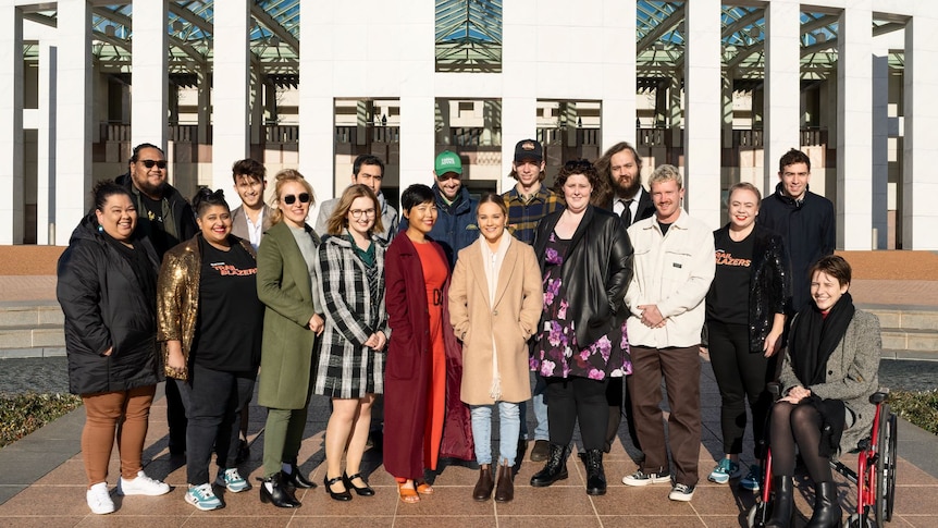 A group of young people from the Trailblazers program standing out the front of Parliament House in Canberra.