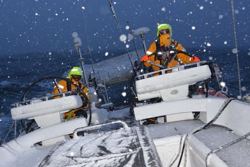 Snow falls over the helm of Katharsis II during voyage to Antarctica, February 2018.