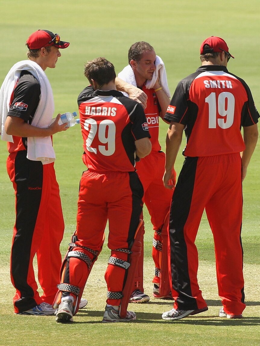 Feeling the heat ... Michael Klinger towels off on his way to 81 for South Australia.
