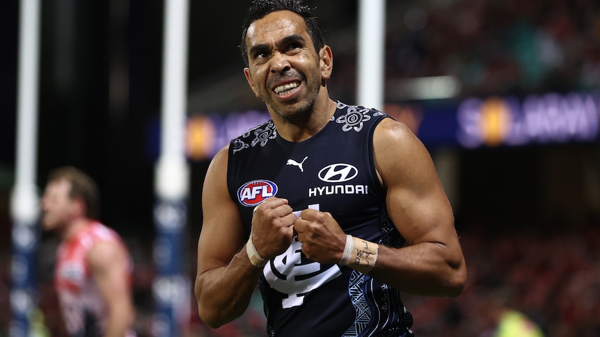 Eddie Betts smiles and clenches his fists together in front of his chest