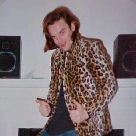 Eugene Kelly wears a leopard print jacket