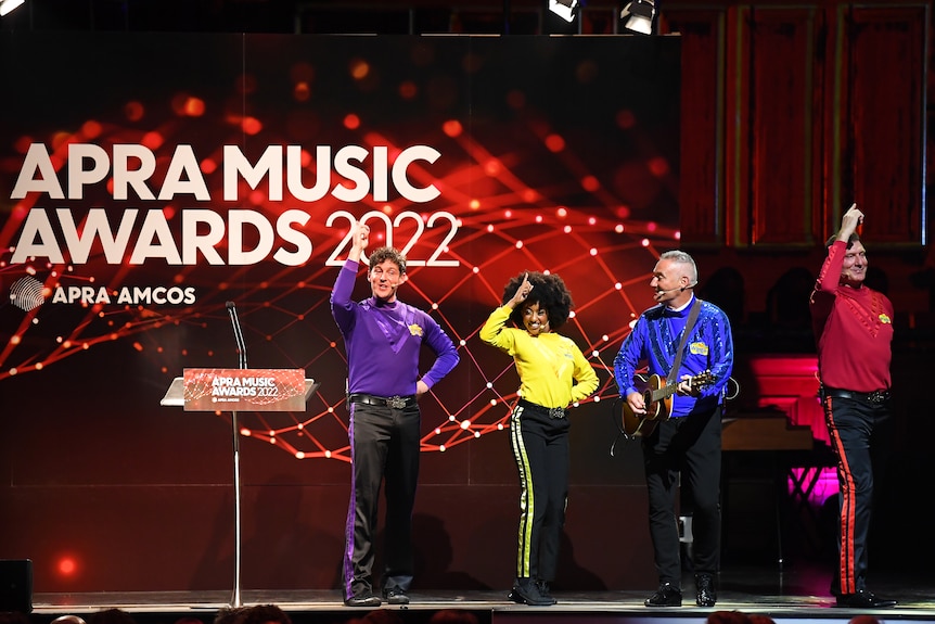 The Wiggles perform in front of a sign that says APRA Music Awards