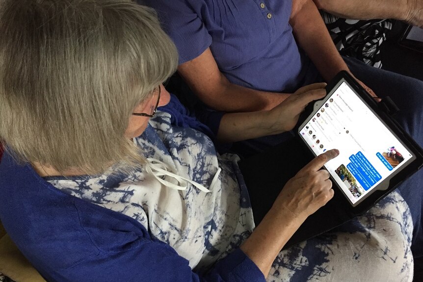 Melita Luck talking to Manus Island refugees on her tablet via facebook