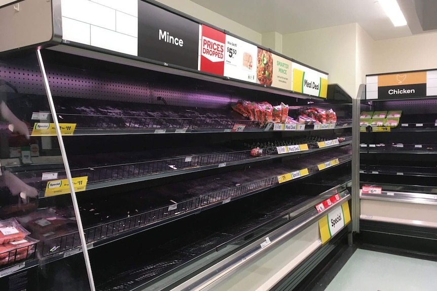 Empty fresh meat fridges in Woolworths supermarket near Brisbane.