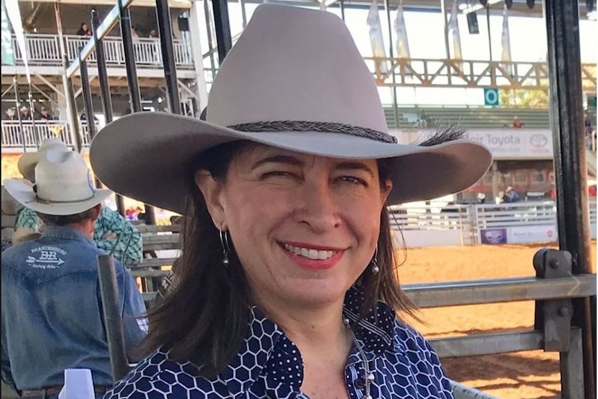 Senator Susan McDonald wearing a wide-brimmed hat and smiling.