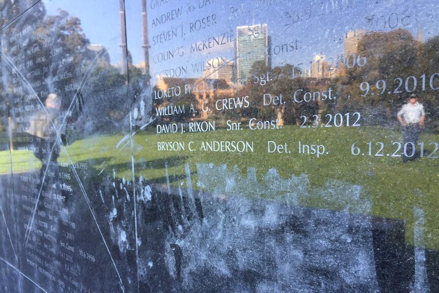 Marks scratched into the NSW Police Force Wall of Remembrance at The Domain in Sydney