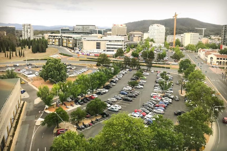 An overhead shot of two development sites being used as carparks in Canberra's city centre.