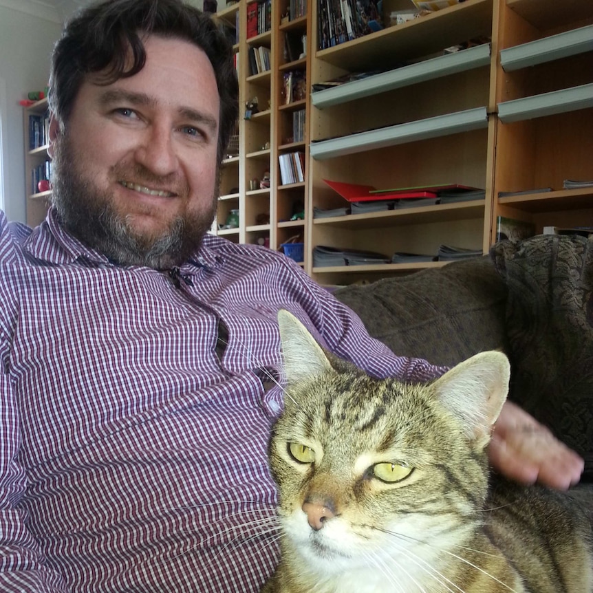 Forde resident Morgan Wilson with his cat ChitChat.