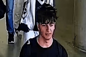 A young man wearing a Nike T-shirt in CCTV footage.