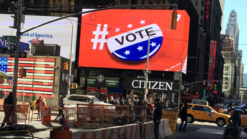 An electronic billboard displays a vote hashtag at Times Square in New York.