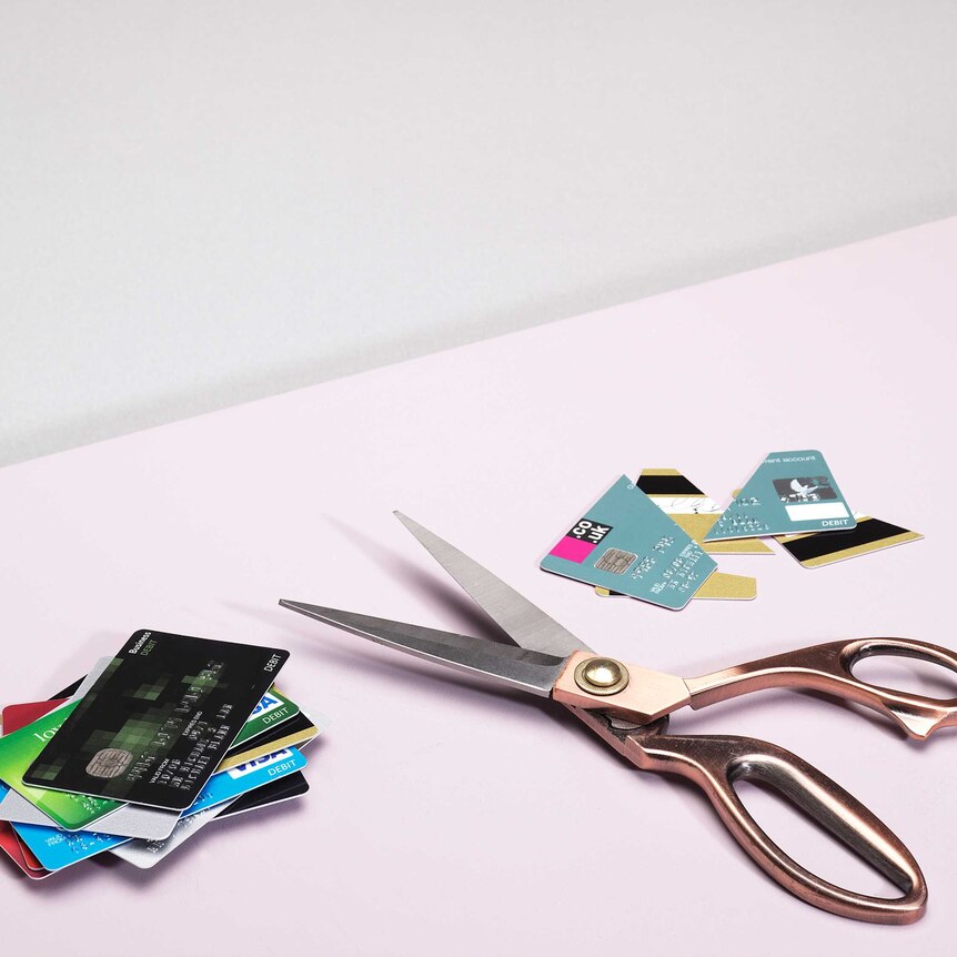 scissors cutting credit card