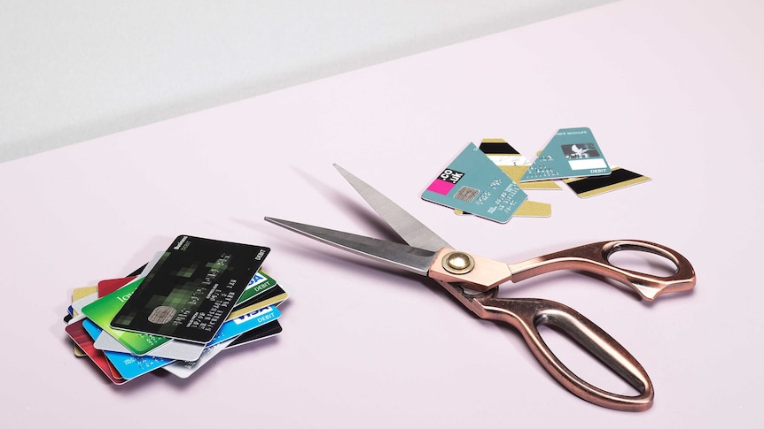 scissors cutting credit card