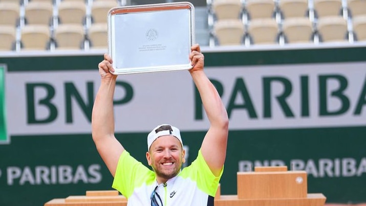 Dylan Alcott holds the French Open trophy