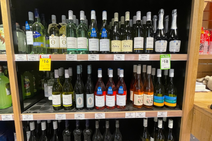 Bottles of zero-alcohol products on a store shelf