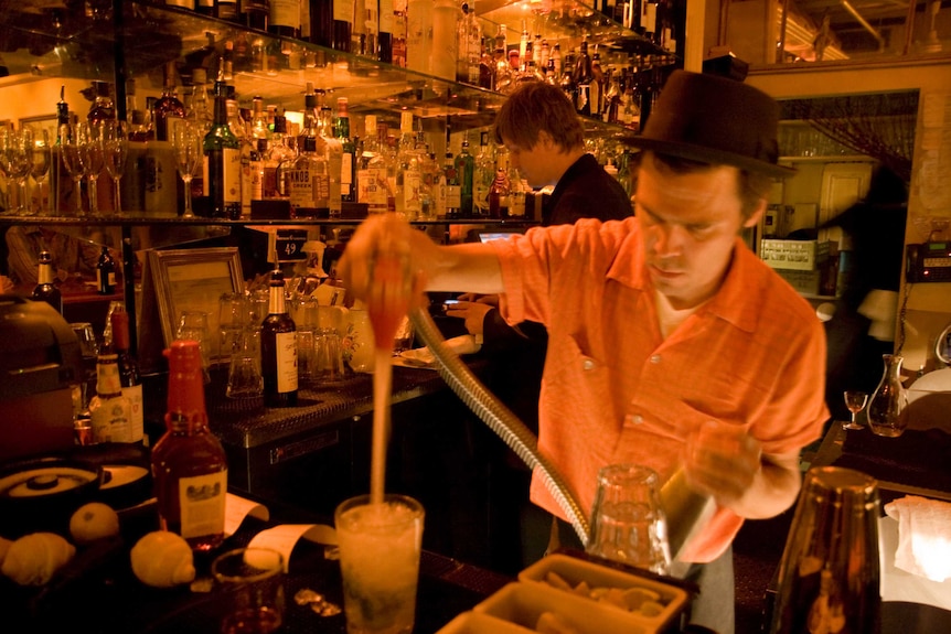 Bartender pours drinks