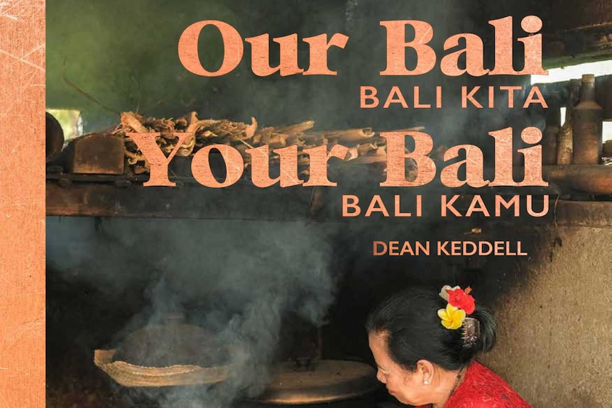 A book cover titled Our Bali Your Bali and showing a women in a red top with flowers in her hair making fire