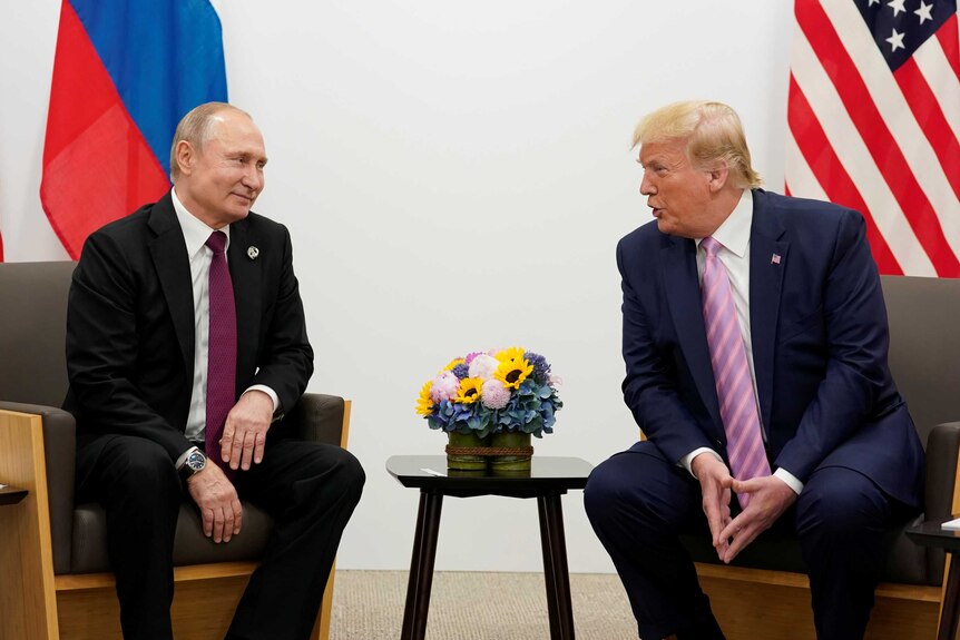 Russia's President Vladimir Putin and US President Donald Trump talk.