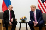 Russia's President Vladimir Putin and US President Donald Trump talk.