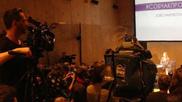 Media packed into small hall