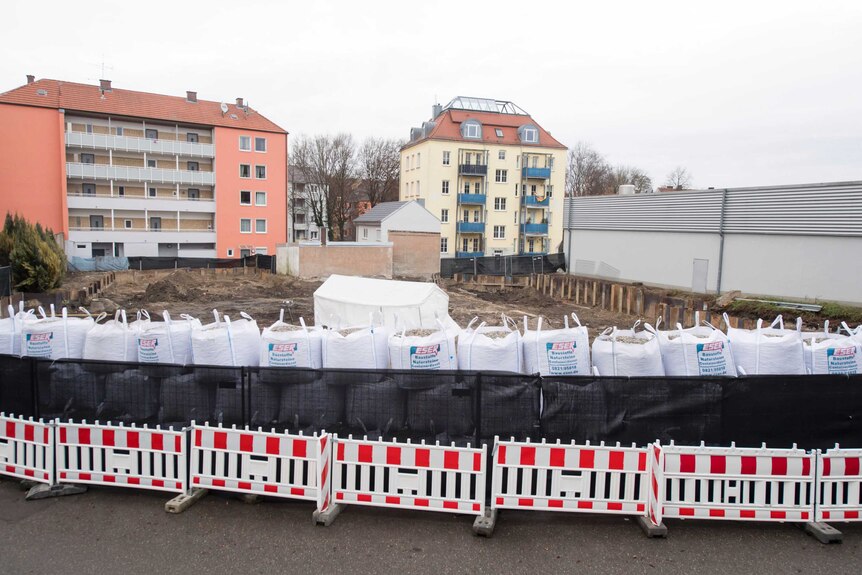 A fence and sand bags line the building site where a bomb was found in Augsburg.