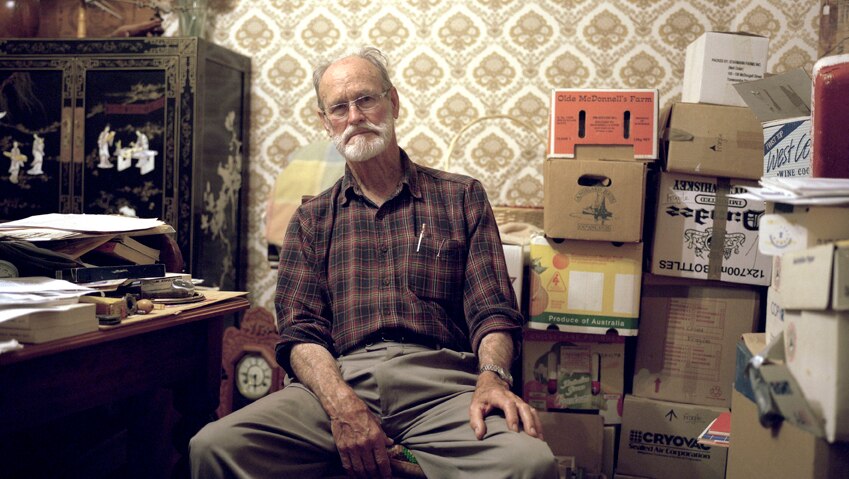 Portrait of a Whistleblower: Avon Hudson in his office surrounded by his archives.