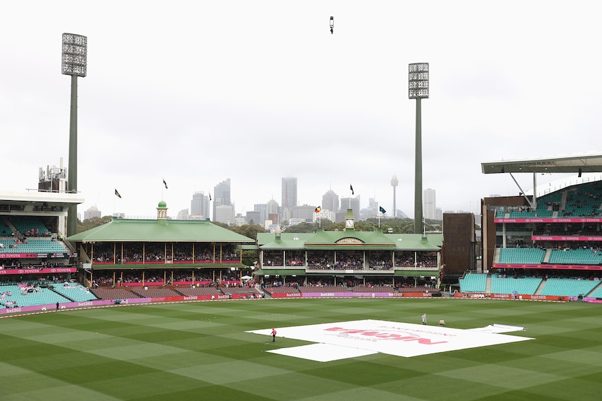 A wide shot of the SCG during a rain delay.